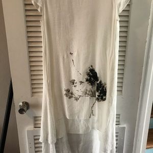 White dress. No brand tag. Runs small